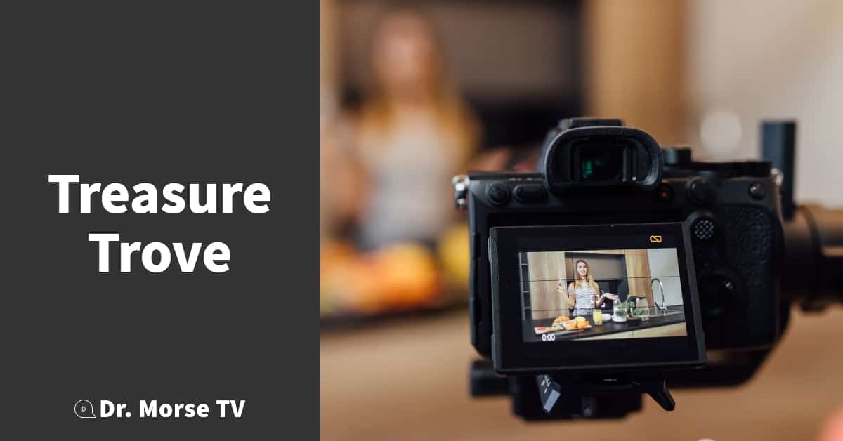 Pretty young blonde woman blogger drinking water in kitchen with healthy food time and camera.